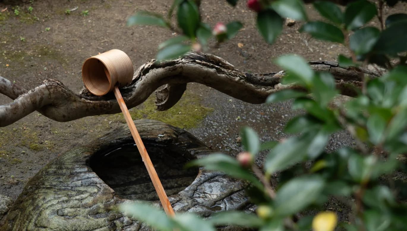 Ladle on a stone bowl in a Japanese garden