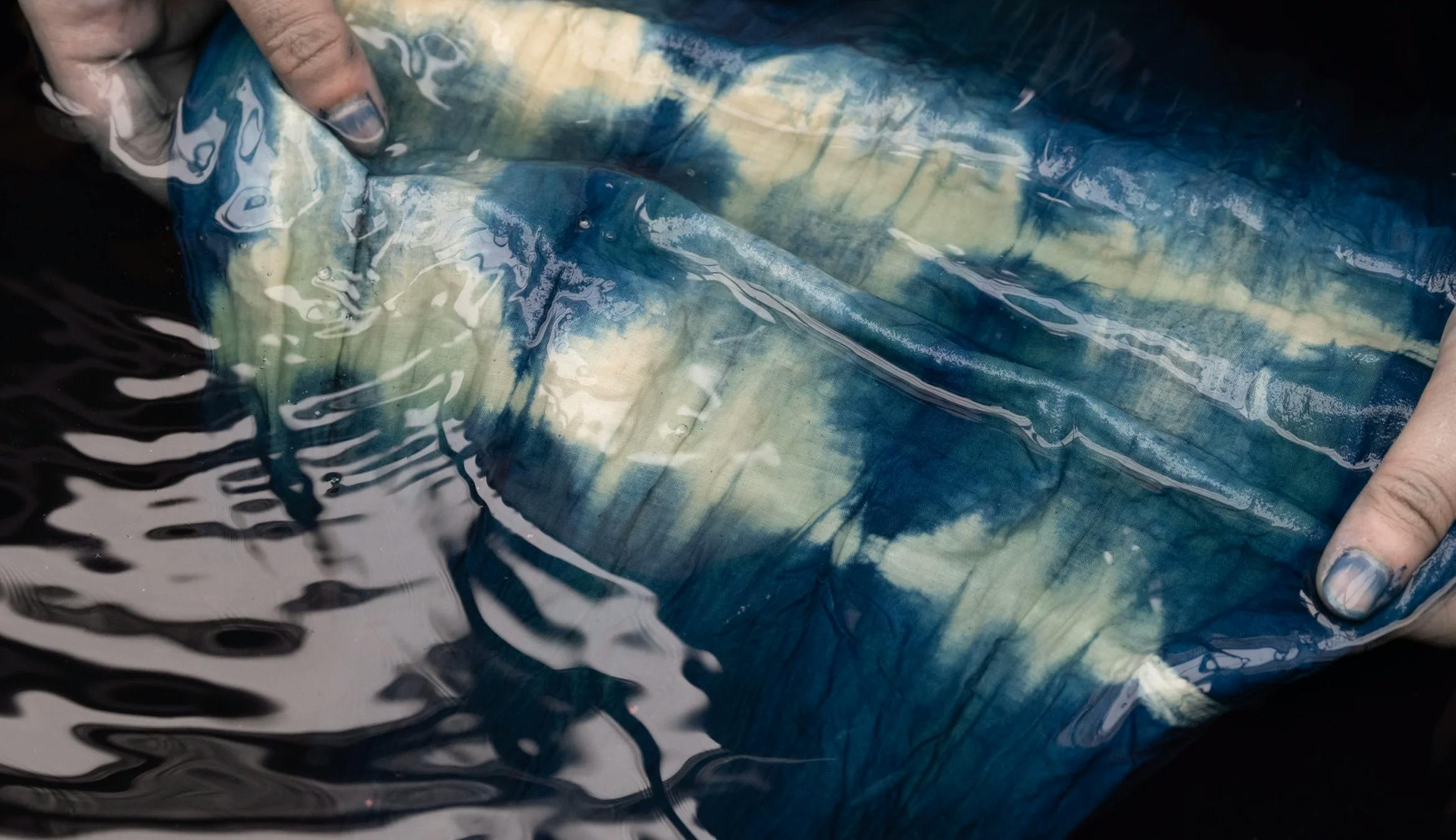 Hand dying fabric in water