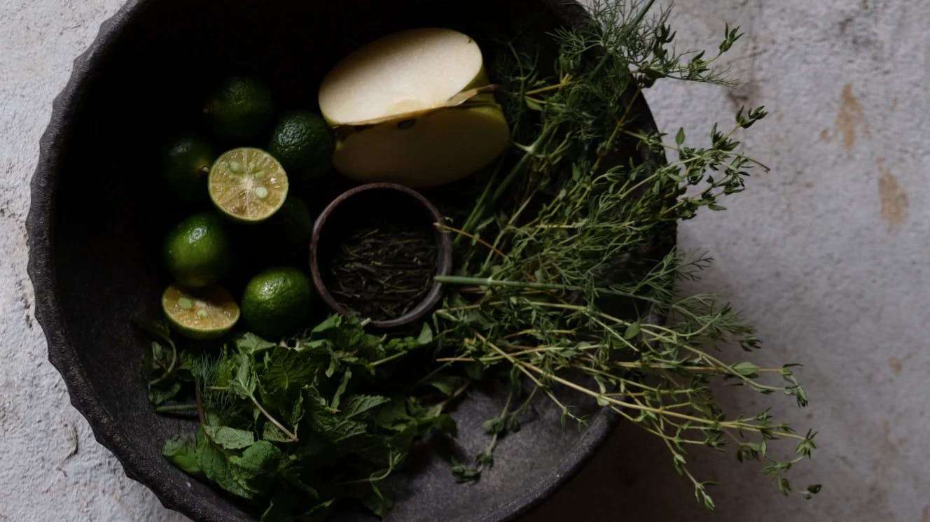 Bowl with various fruits and herbs