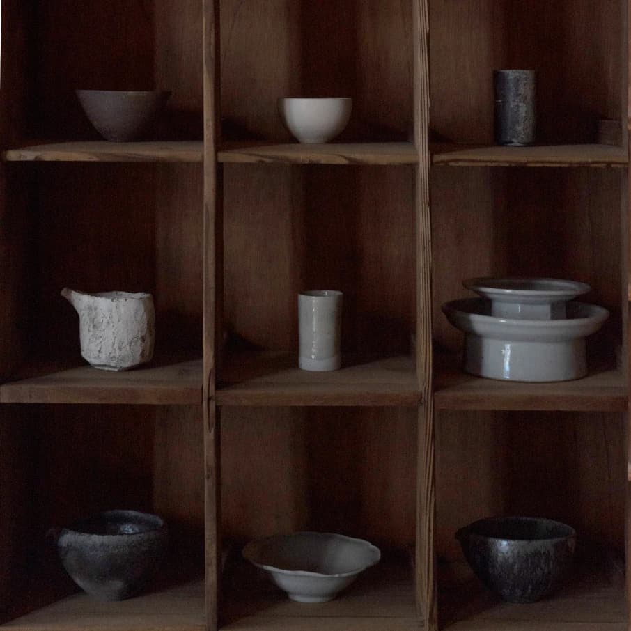 Collection of finished ceramic pieces displayed on shelves