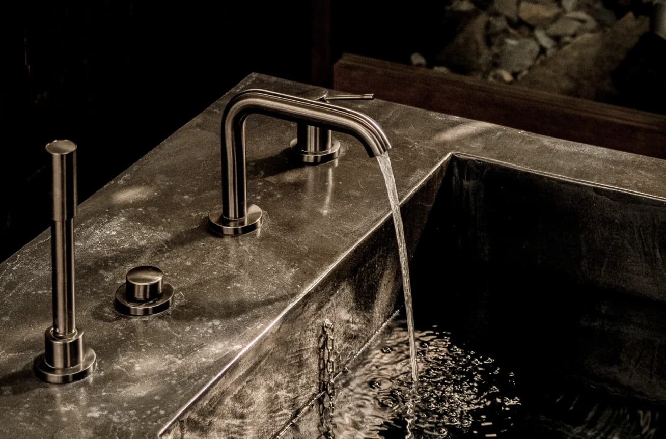 Stone bathtub faucet with running water