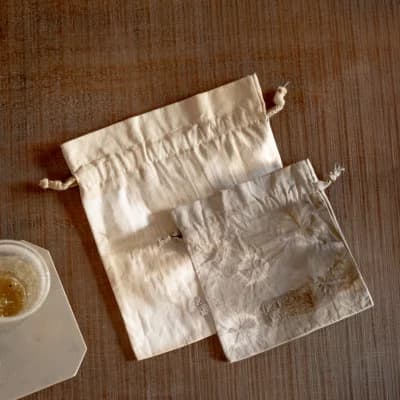 Pouring fermented amazake from a glass carafe