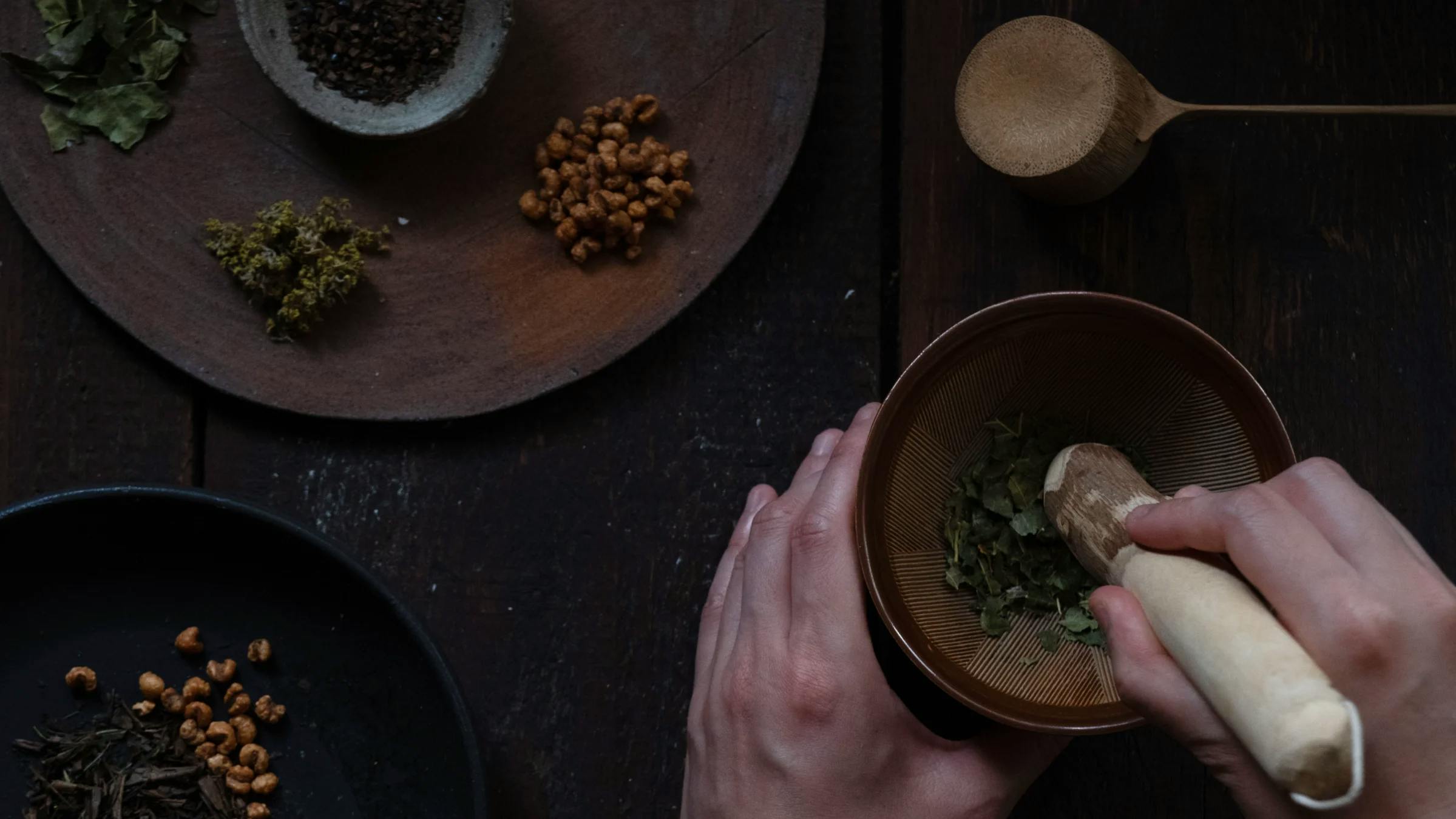 Herbs, dried fruits, and seeds arranged in a bowl