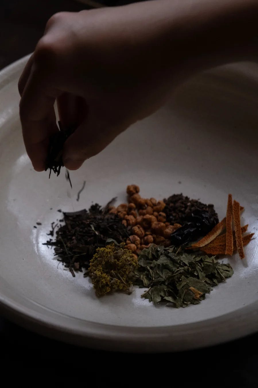 Grinding herbs with mortar and pestle