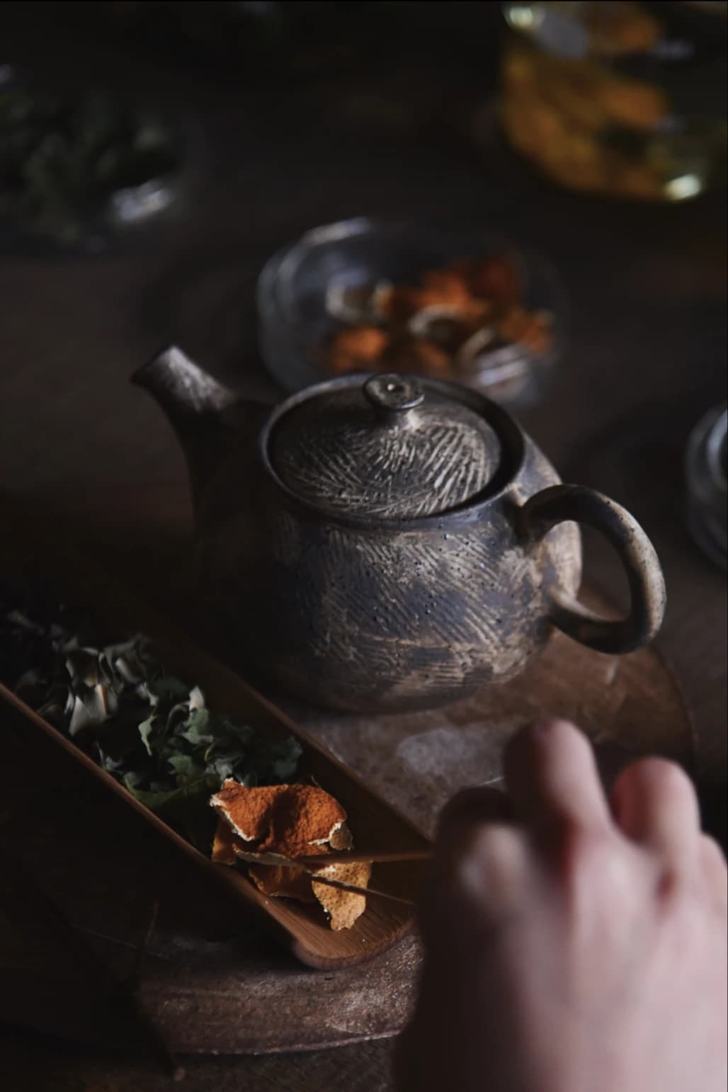 Hands performing tea ceremony rituals