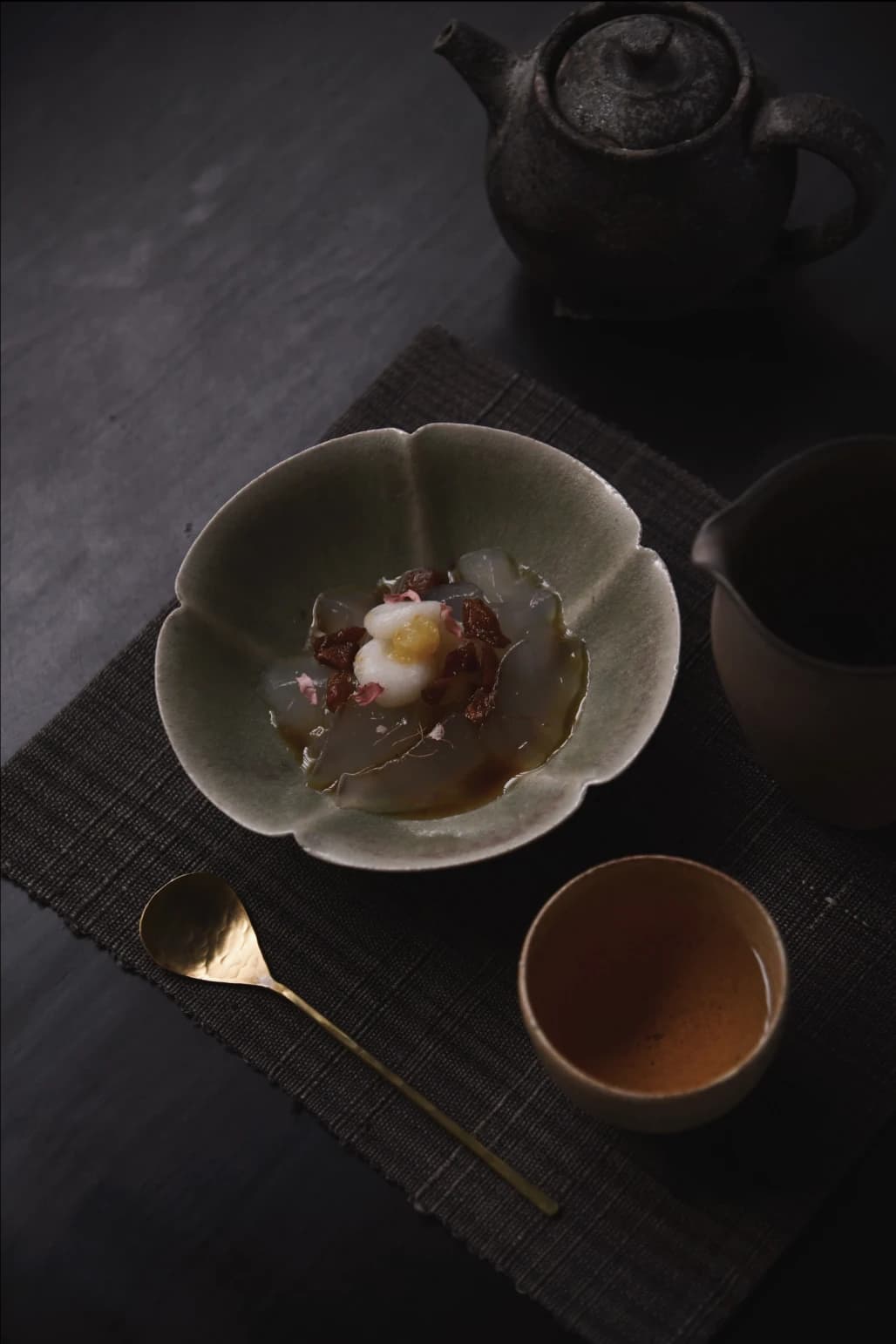 Close-up of tea being prepared in traditional vessel