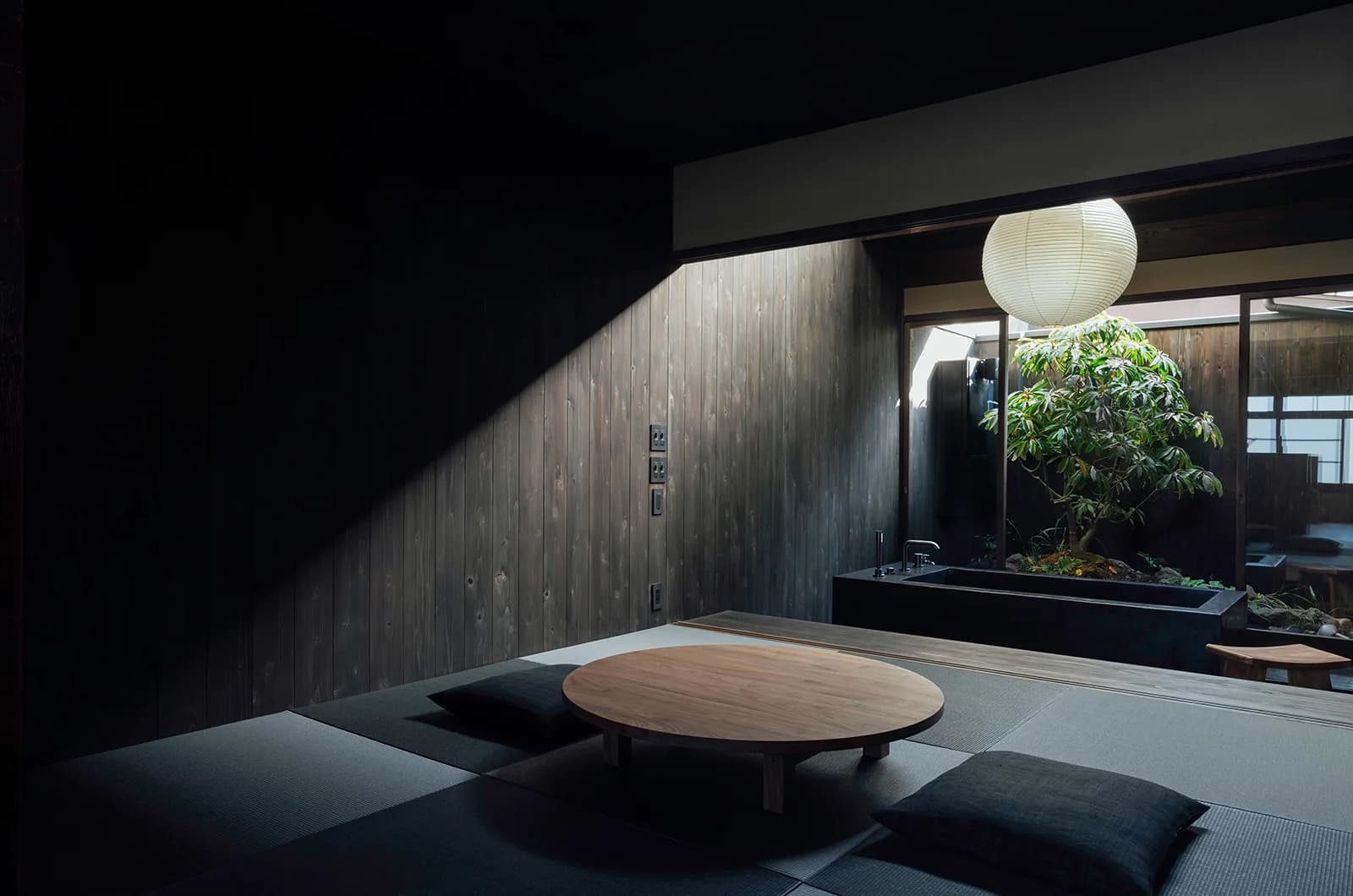 Maana Kamo living area with bathtub and garden