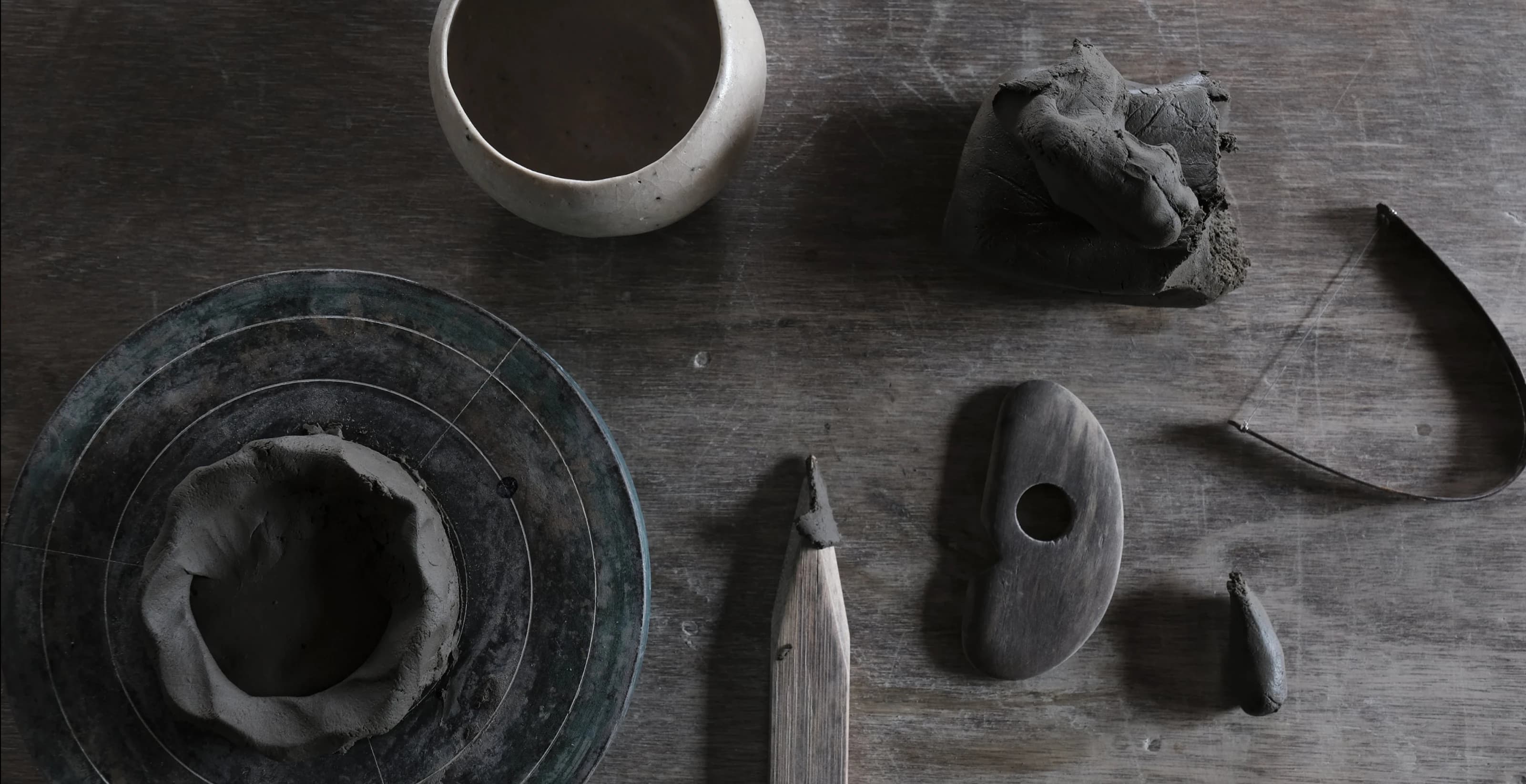 Pottery workshop space with natural lighting and clay working stations