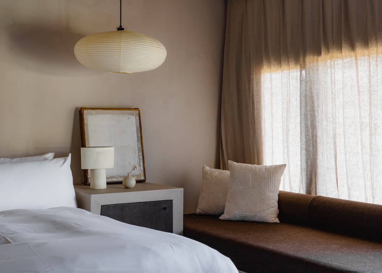 View of bed and seating in Suite 1 of Maana Kiyomizu