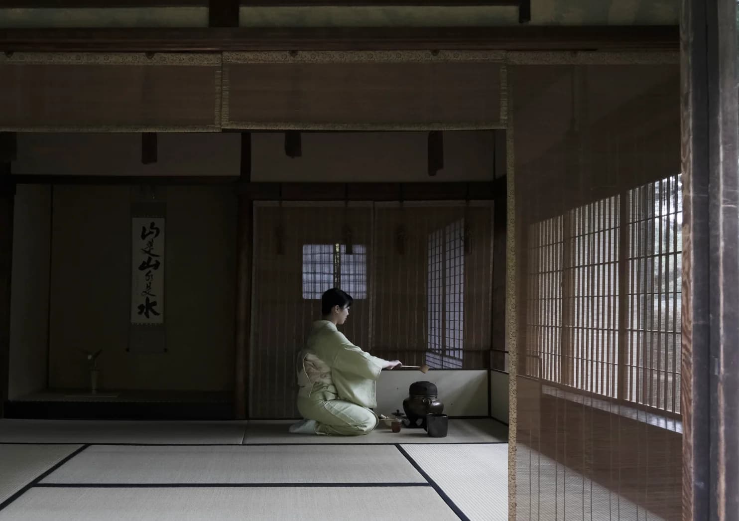 Woman making tea in a Japanese room